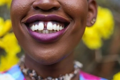 Woman smiling with teeth with gap