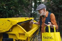 senior man recycling plastic bottle
