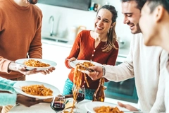 Image People eating pasta.