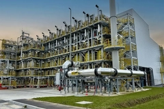 Image A large industrial building with pipes