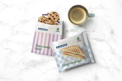 Food in paper packaging with a cup of coffee