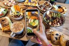 Image person taking picture of food