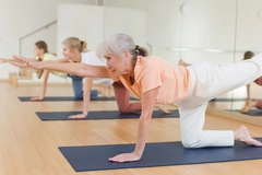 Image Senior woman doing yoga