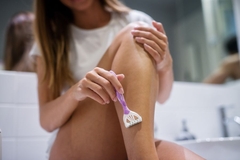 Dollar Shave Club women A woman shaving her leg.