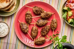 plant based kebab on red plate plant based kebab on red plate