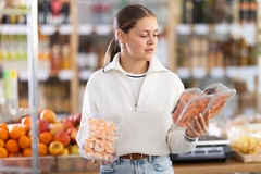 Young consumer shopping for seafood.