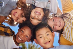 happy kids smiling in a circle
