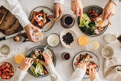 Family or friends having breakfast or brunch together, top view