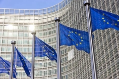 EU flags waving outside in front of building