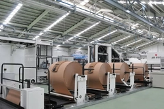 Image A large roll of paper in a factory