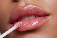 Image Applying lip gloss.