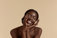 Image Black woman looking happy.