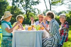 Healthy seniors around a table