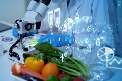 Image Person in lab with microscope and vegetables