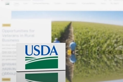 USDA logo with farming in background