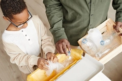 Boy recycles plastic packaging