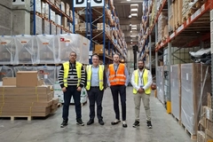 Image A group of men in a warehouse