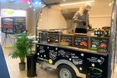 Image food cart with chef cooking hybrid meat