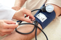 Legumes soy hypertension risk woman checking blood pressure at doctor