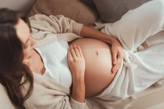 Image Pregnant woman taking folate supplement