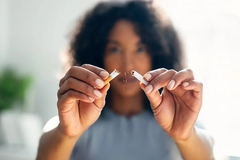 Woman breaking a cigarette