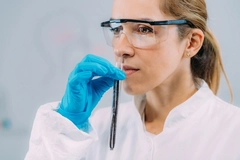 female scientist smelling vanilla