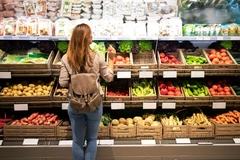 Image Woman shops for fruit and vegetables.