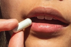 Woman taking a pill