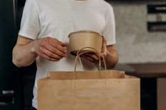 man with paper packaging