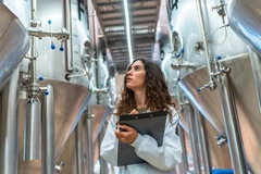 Image Woman works in fermentation technologies setting.