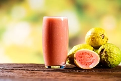 Image glas of fresh guava juice on wooden table