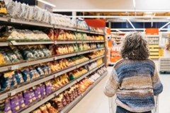 older woman shopping in supermarket