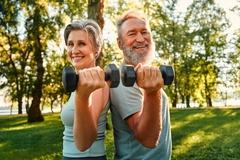Elderly woman weight lifting