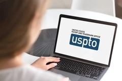 Image USPTO website woman searching for patent