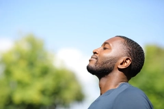Image Profile of a black man breathing fresh air in nature