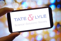 Image A hand holding a phone that says Tate & Lyle on it.