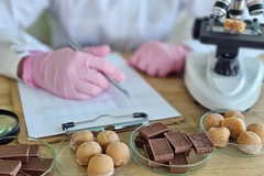 Image Food being formulated in a lab with emulsifiers.