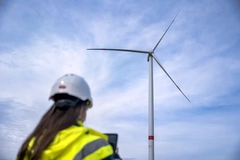 Image woman with helmet at windfarm
