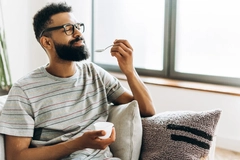 Image Woman eating yogurt