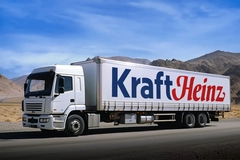 Image A Kraft Heinz semi-truck driving through the desert.