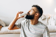 Image Man drinking probiotic dairy beverage