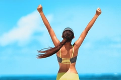 Image Goal achievement happy woman with open arms outdoors in success