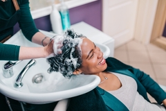Image Person having hair washed at salon.