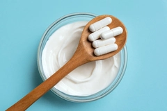 Image Yogurt and probiotic capsules