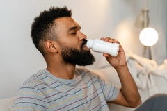 Image Man drinking wellness shot