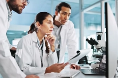 Image 3 scientists on computer for breakthrough, clinical trial or discovery