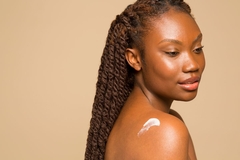 Image woman with cream on shoulder