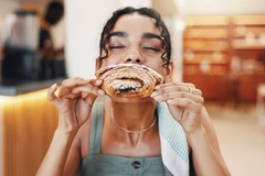 Image woman eating croissant