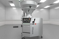 Image vacuum filling machine in a clean, tiled room