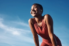 Image A woman smiling outside.